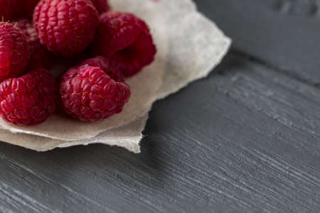 Original wallpaper for your desktop. Fresh raspberry pile on the wooden tableの写真素材