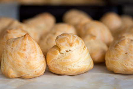 Front view of profiteroles. Appetizing homemade food for breakfast.