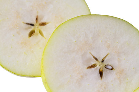 Macro view of pear slice. Nice background of cut fresh pear with seeds