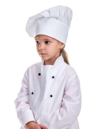 Sad and serious chef girl in a cook uniform. Human emotions, facial expression feeling, attitudeの写真素材