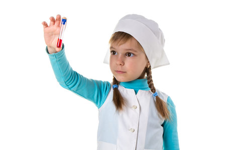 Nurse girl with red reactive in test tube, isolated in white background. Young nurse with tube in...