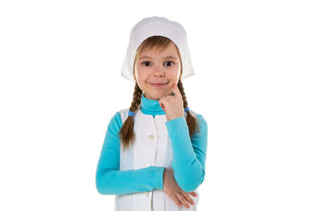 Professional happy female nurse, holding the hand under the chin, and another one under the breast, landscapeの写真素材