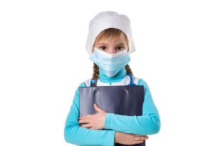 Female nurse wearing mask, hugs a notebook, looking straight at the camera, isolated on the white background, landscapeの写真素材