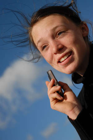 smiling girl and phoneの写真素材