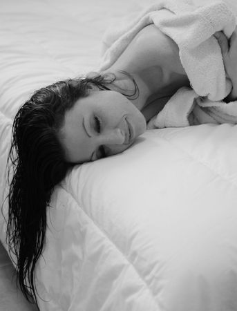 Portrait of Fresh and Beautiful brunette woman wearing white bathrobeの写真素材