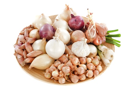 group of varieties onions in a wood dishの写真素材