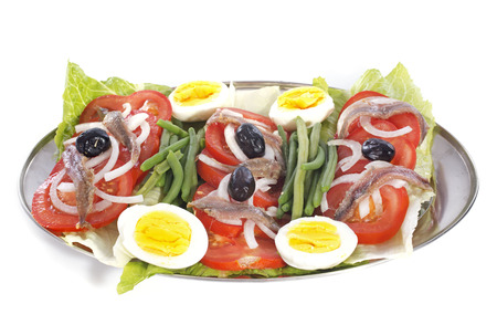 mixed salad in front of white backgroundの写真素材