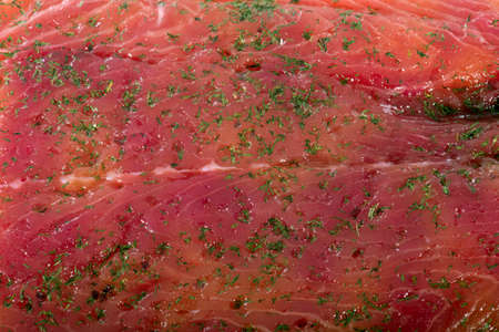 close up of a salmon fillet with dillの写真素材