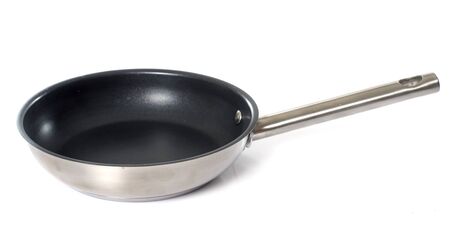 large frying pan in front of white backgroundの写真素材