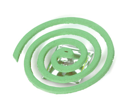 Mosquito repellent incense coils in front of white background