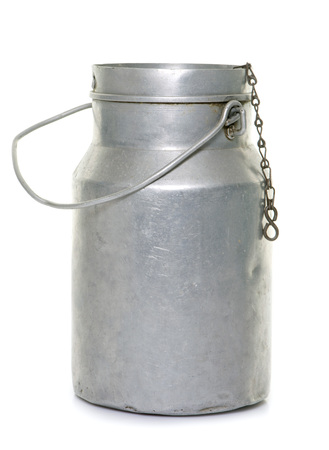 milk jar in front of white backgroundの写真素材