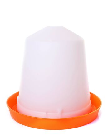 orange chicken feeder in front of white backgroundの写真素材