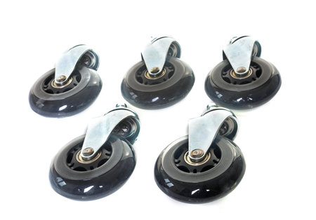 Furniture caster wheel in front of white background