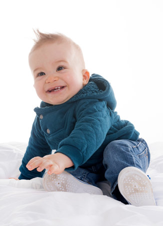 human baby in front of white background