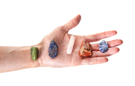 stone in hand in front of white backgroundの写真素材