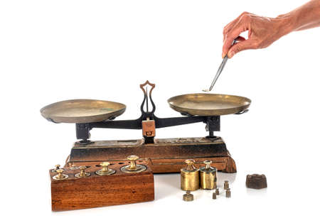 Roberval balance in front of white backgroundの写真素材