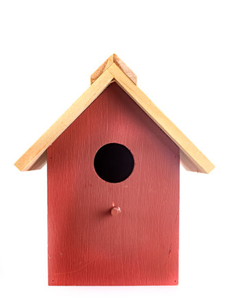 wood birdhouse in front of white backgroundの写真素材
