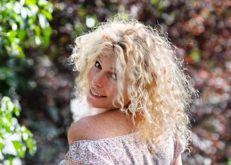 young woman gardening in her kitchen gardenの写真素材