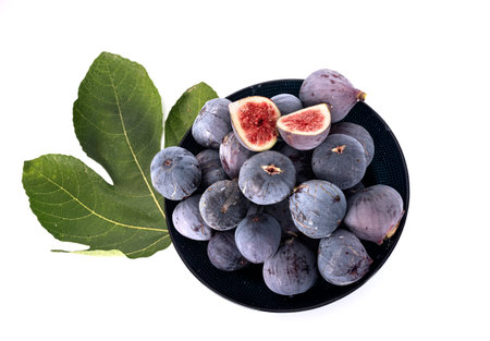 purple figs in front of white backgroundの写真素材