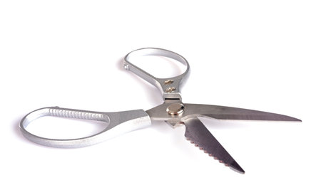 pair of scissors in front of white background