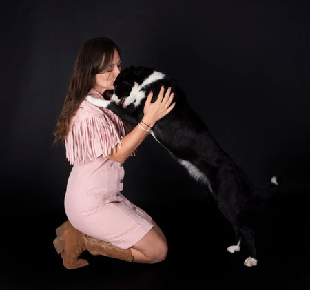 puppy border collie and womanの写真素材