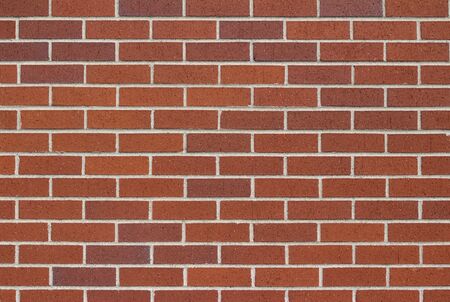 Traditional red brick wall texture in running bond brickwork patternの写真素材