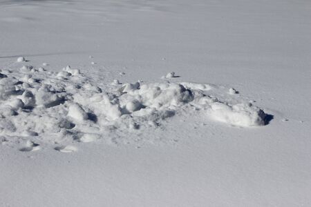 Contrasting snow textures from shoveled snow onto the groundの写真素材