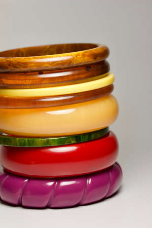 Close up view of vintage bakelite (baekelite) bangle braceltets on white background, with copy spaceの写真素材