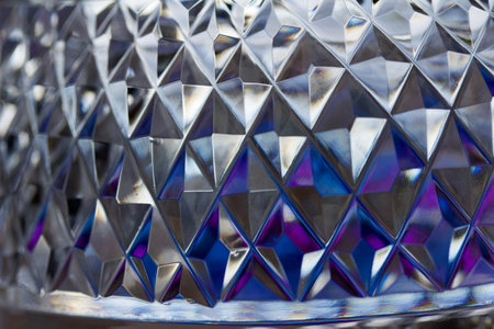 Macro abstract art background of beautiful lead crystal glass surface, reflecting bright natural...