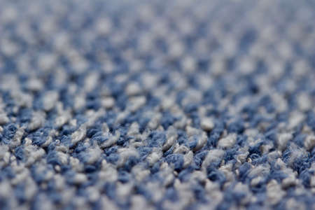 Macro art abstract background of a vintage blue and white cotton fabric towel texture with fringeの写真素材