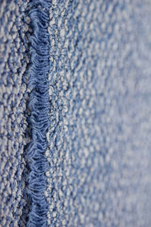 Macro art abstract background of a vintage blue and white cotton fabric towel texture with fringeの写真素材