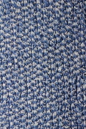 Macro art abstract background of a vintage blue and white cotton fabric towel texture with fringe
