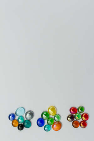 Abstract art texture background of colorful glass bead dragon tears on a white background, with copy spaceの写真素材