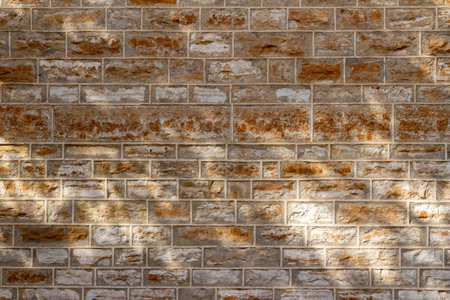Antique 19th Century natural limestone block wall texture background with tuckpointing mortar...