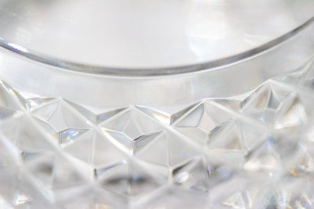 Macro abstract art background design of beautiful defocused lead crystal glass texture with hand cut...