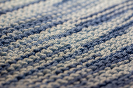 This image shows a macro abstract texture background of a hand-knitted yarn swatch in a basic garter...