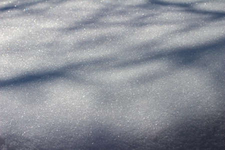 This images shows a full frame close-up abstract texture background of heavy snow on the end of a home rooftop, with copy space.の写真素材