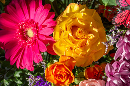 Full frame macro texture view of roses, gerbera daisies and aster flowers in an indoor...
