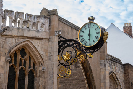 Close up view of a beautiful modern style clock on the stone walls surrounding the city of York, England.の写真素材