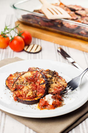 Delicious parmigiana on white plate on tableの写真素材