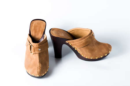 Woman brown shoes on white backgroundの写真素材
