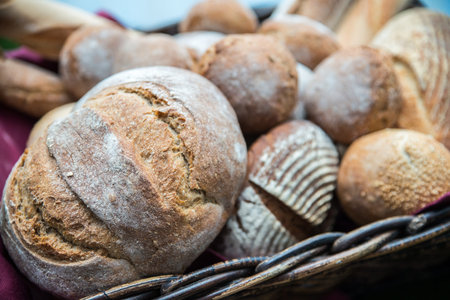 Delicious bread and rolls in a wicker basket 