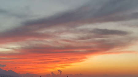 Colourful sunset sky with mountain views.の写真素材