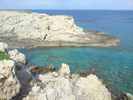 Beautiful cove, aqua coloured sea white rocky hills.の写真素材