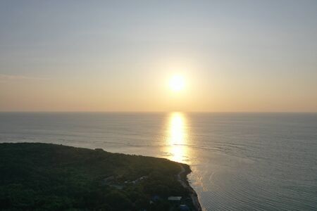 Sunset over the beach in San Juan Philippinesの写真素材