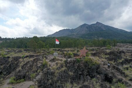 Indonesian Flag flying from Mt Batur viewpoint in Bali Indonesiaの写真素材