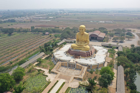 Buddha statute in open field in Thailandの写真素材