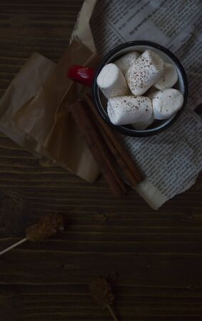 Top view of autumnal hot chocolate with delicious marshmallows on rustic background.の写真素材