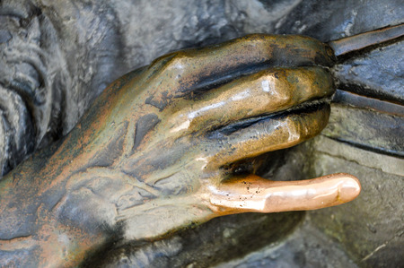 detail of Christopher Columbus statue in Turin, Italy. Rubbing the little finger is supposed to bring good luck, hence the discoloringの写真素材