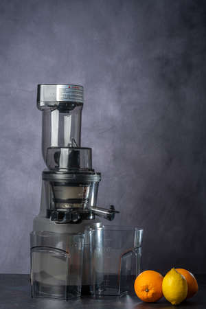 photo shoot of an orange and lemon juice production using a juice extractor.の写真素材